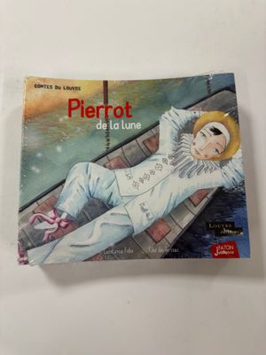 un livre sur lequel figure la photo d'une personne allongée sur un bateau