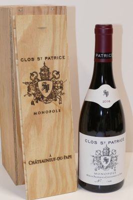 a bottle of wine and a wooden box on a table