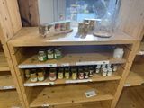 many jars of food on the shelves in the store