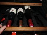 many bottles of wine sitting in a wine cooler