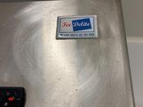 a close up of a metal object with a sticker on it