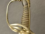 an old gold sword with a lion head on top of it
