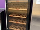 two refrigerators that are next to each other on the floor