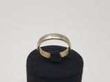 a close up of a ring on top of a black box