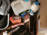 a picture of a cluttered bathroom with a lot of cleaning supplies