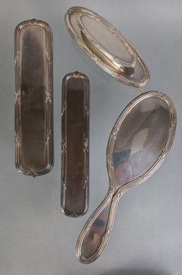 three silver spoons and a mirror on a gray surface