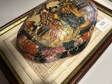a picture of a decorative box on display in a glass case