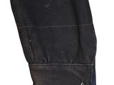 a close up of a black jacket with a button on the back