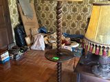 a lamp that is sitting on a table in a room
