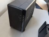 a small black box sitting on top of a white table