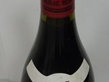 a bottle of wine that is sitting on a table