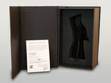 a black box with a piece of art inside of it