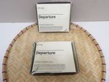 two boxes of departure sitting on top of a bamboo tray