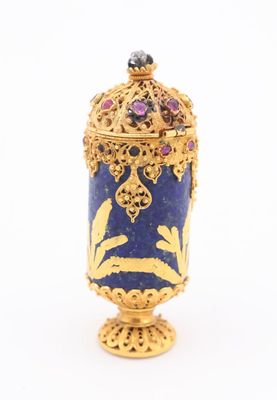 an image of a blue and gold vase with a flower decoration
