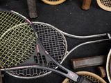 two tennis rackets that are laying on the ground