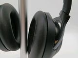 a pair of headphones that are on a stand