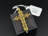 a close up of a cross on a small box with a tag