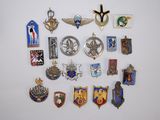 a lot of badges on the wall of a room