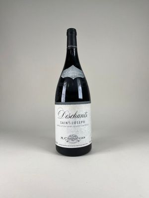 a bottle of wine that is sitting on a table