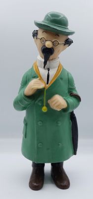 a figurine of a man in a green coat and hat