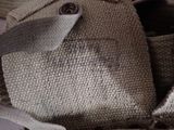 a close up of a bag with a button on it