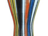 a multicolored vase sitting on a white surface