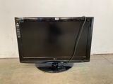a close up of a monitor on a stand in a room