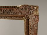 a close up of a mirror with a decorative design on it