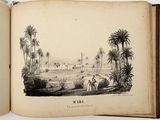 an open book with a picture of a village in the middle of it