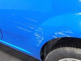 a close up of a blue car that has been painted