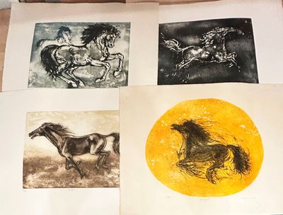 four different pictures of horses on a sheet of paper