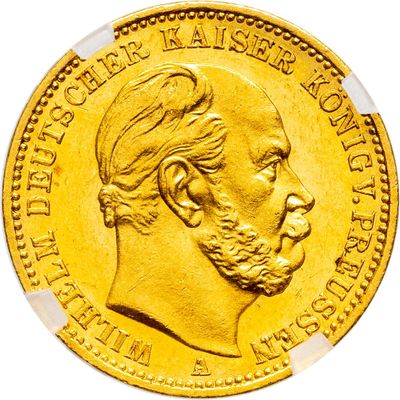 a close up of a gold coin with a man ' s face on it
