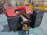 a picture of a machine that is cutting a piece of wood