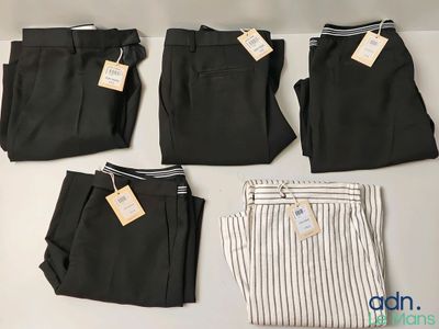 four pairs of men ' s dress pants with tags on them