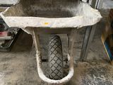 a wheelbarrow in the middle of a wheelbarrow in the middle of a garage