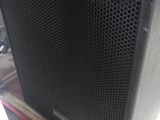 a close up of a speaker sitting on top of a table