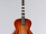 an image of a guitar that is on a stand