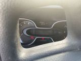 a close up of a car dashboard with a clock on it