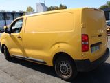 a yellow van that is parked in a parking lot