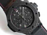 the watch is black and has a pink stitching on the strap