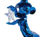 blue glass figurine of a wizard holding a star