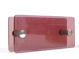 a pink plastic box with a metal latch on it