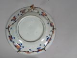 a plate with a blue and orange design on it