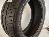 a close up of a tire on a white surface