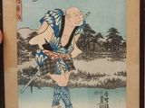 tableau représentant un homme en costume traditionnel tenant un couteau et une cigarette