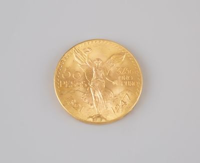 a gold coin with a picture of a woman on it