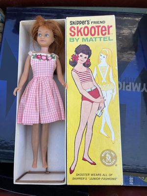 a doll that is in a box on a table
