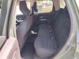 the back seats of a car with a seat belt in the back