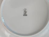 a white plate that has a picture of a man on it