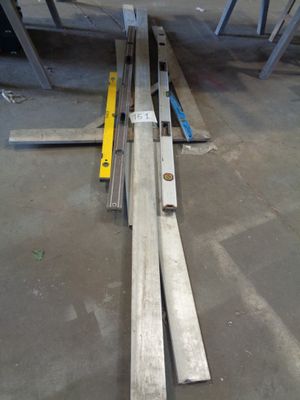 several pieces of metal are laying on the floor in a room